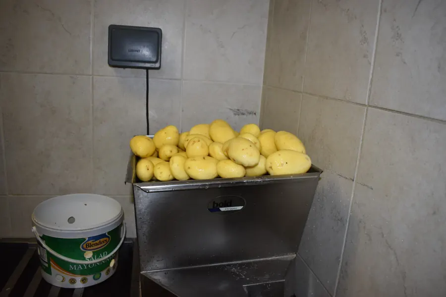 Freshly peeled potatoes ready to be cut into homemade chips